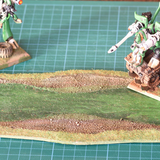 Single layer of cardboard did not warp a bit despite a lot of glue. Polymer glue.